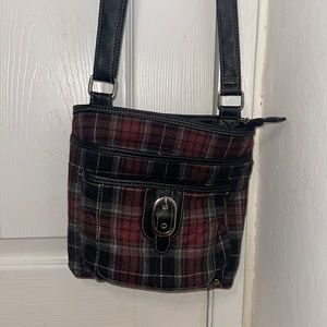 Plaid black n Red Cross over bag with adjustable straps it has 3 main pockets